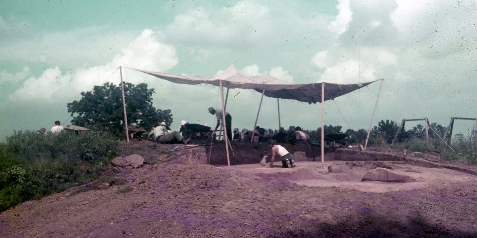 An image of the excavation of the Angel Mounds under a canopy to provide shade.